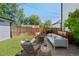 Inviting backyard patio with a cozy seating area, fire pit, and string lights for outdoor relaxation at 2571 S Cherokee St, Denver, CO 80223