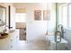 Bright bathroom featuring double vanity, standalone tub, glass shower and stylish decor at 2571 S Cherokee St, Denver, CO 80223