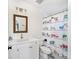 Bathroom featuring a white vanity, patterned shower curtain, and tile flooring at 2571 S Cherokee St, Denver, CO 80223