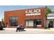 Exterior of Kaladi Coffee Roasters, featuring a modern facade, large windows, and a motorcycle parked outside at 2571 S Cherokee St, Denver, CO 80223