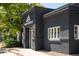 Modern building exterior with dark gray facade, white trim, and prominent 'Traverse' signage at 2571 S Cherokee St, Denver, CO 80223