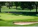 Picturesque golf course with a green, sand traps, and a flag, perfect for leisurely recreation at 2571 S Cherokee St, Denver, CO 80223