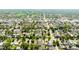 Wide aerial view of a neighborhood with tree-lined streets and diverse architecture in an urban setting at 2571 S Cherokee St, Denver, CO 80223