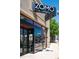 Modern restaurant facade with large windows, a sleek sign, and an inviting entrance at 2571 S Cherokee St, Denver, CO 80223