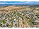 Panoramic aerial view of a community surrounded by trees and roads at 1805 Parkdale N Cir, Erie, CO 80516