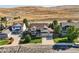 Aerial view of a two-story home featuring lush landscaping, a well-maintained lawn, and a two-car garage at 1805 Parkdale N Cir, Erie, CO 80516