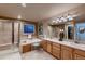 Bathroom features a large vanity, soaking tub, and a separate glass-enclosed shower at 1805 Parkdale N Cir, Erie, CO 80516