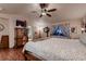 Bedroom showcases a four-poster bed, dresser, and a ceiling fan for comfort at 1805 Parkdale N Cir, Erie, CO 80516