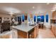 Open concept kitchen with a center island, modern appliances, and ample natural light creates a welcoming space at 1805 Parkdale N Cir, Erie, CO 80516