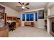 Cozy home office featuring built-in bookshelves, a comfortable workspace, and large windows with natural light at 1805 Parkdale N Cir, Erie, CO 80516