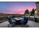 Enjoy the cozy outdoor firepit and beautiful sunset on the home's spacious patio at 1805 Parkdale N Cir, Erie, CO 80516