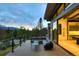 Relax on the outdoor balcony, featuring comfortable seating and stunning mountain and forest views at 132 N Gold Flake Ter, Breckenridge, CO 80424
