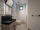 Contemporary bathroom with unique mirror and black fixtures complemented by modern design at 132 N Gold Flake Ter, Breckenridge, CO 80424