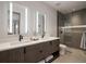 Modern bathroom with double vanity, sleek faucets, and glass-enclosed shower at 132 N Gold Flake Ter, Breckenridge, CO 80424
