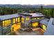 Striking exterior showcases a modern home with architectural details and stunning mountain backdrop at 132 N Gold Flake Ter, Breckenridge, CO 80424