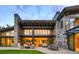 Expansive stone patio offers seamless indoor-outdoor living, complete with comfortable seating and an outdoor dining area at 132 N Gold Flake Ter, Breckenridge, CO 80424