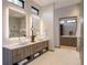 Elegant main bathroom featuring double sinks, modern fixtures, and walk-in shower at 132 N Gold Flake Ter, Breckenridge, CO 80424