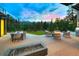 Enjoy mountain views from this patio with a fireplace, dining, and lounge seating for outdoor relaxation and entertaining at 132 N Gold Flake Ter, Breckenridge, CO 80424