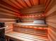Relaxing cedar sauna with built-in seating, soft lighting, and rustic accents for a tranquil experience at 132 N Gold Flake Ter, Breckenridge, CO 80424