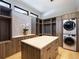 Custom walk-in closet with ample storage, built-in shelving, and laundry area at 132 N Gold Flake Ter, Breckenridge, CO 80424