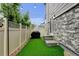 Well-maintained backyard with artificial turf, a privacy fence, and a grill, ideal for outdoor living at 3765 W 88Th Ct, Westminster, CO 80031