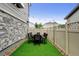 Charming backyard with artificial turf and a patio dining set perfect for outdoor entertaining at 3765 W 88Th Ct, Westminster, CO 80031