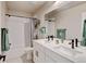 Modern bathroom featuring double sinks and subway tile shower at 3765 W 88Th Ct, Westminster, CO 80031