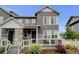 Charming gray two-story home with stone accents and a cozy front porch at 3765 W 88Th Ct, Westminster, CO 80031