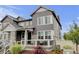Charming gray two-story home with stone accents and a cozy front porch at 3765 W 88Th Ct, Westminster, CO 80031