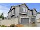 Modern home featuring stone accents, a two-car garage, and well-maintained landscaping at 3765 W 88Th Ct, Westminster, CO 80031