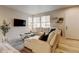 Cozy living room with comfortable seating, plush sectional sofa, stylish coffee table, and decorative shelving at 3765 W 88Th Ct, Westminster, CO 80031