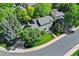 An aerial view of a home displaying meticulous landscaping and mature trees at 3726 E Nichols Ave, Centennial, CO 80122