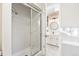 Bright bathroom showcasing a glass-enclosed shower and a stylish vanity at 3726 E Nichols Ave, Centennial, CO 80122