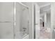 Bathroom features glass shower doors, a white shower tub, and a tiled floor at 3726 E Nichols Ave, Centennial, CO 80122