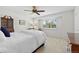 Bright bedroom features a ceiling fan and a window with exterior views at 3726 E Nichols Ave, Centennial, CO 80122