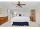 Bedroom featuring wood furniture, neutral colors, and a ceiling fan at 3726 E Nichols Ave, Centennial, CO 80122