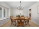 Bright dining room with natural light, neutral carpet, and traditional wooden table at 3726 E Nichols Ave, Centennial, CO 80122