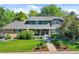 Inviting home with manicured front yard and charming, covered entryway at 3726 E Nichols Ave, Centennial, CO 80122