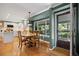 Eat-in kitchen featuring a wood table with seating and a view to the backyard at 3726 E Nichols Ave, Centennial, CO 80122