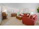 Warm living room with comfortable seating, a wooden desk, piano, and natural light, perfect for relaxing or entertaining at 3726 E Nichols Ave, Centennial, CO 80122