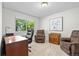 A comfortable home office with natural light and neutral decor at 3726 E Nichols Ave, Centennial, CO 80122