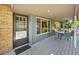 Covered patio with outdoor seating with view inside at 3726 E Nichols Ave, Centennial, CO 80122