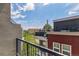 Balcony view overlooking neighborhood gardens and cityscape at 2876 W 53Rd Ave # 305, Denver, CO 80221