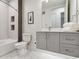 Modern bathroom with stylish tiles, gray vanity, and shower/tub combo at 2876 W 53Rd Ave # 305, Denver, CO 80221