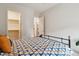 Comfortable bedroom featuring a walk-in closet and neutral color palette at 2876 W 53Rd Ave # 305, Denver, CO 80221