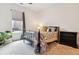 Bright bedroom with a cozy bed, natural light, and neutral decor at 2876 W 53Rd Ave # 305, Denver, CO 80221
