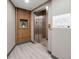 Modern elevator with decorative wood paneling and a floor plan diagram, providing convenient building access at 2876 W 53Rd Ave # 305, Denver, CO 80221
