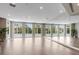 Spacious fitness room with mirrored walls, ample natural light, and hardwood floors at 2876 W 53Rd Ave # 305, Denver, CO 80221