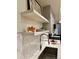 A modern kitchen featuring white countertops, light gray cabinets, and stainless steel appliances at 2876 W 53Rd Ave # 305, Denver, CO 80221