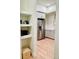 Open view into a kitchen with stainless steel appliances and light gray cabinetry at 2876 W 53Rd Ave # 305, Denver, CO 80221